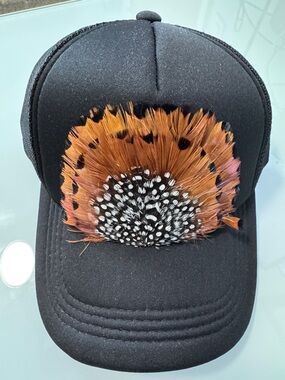Black Trucker Hat with Decorative Feather design.